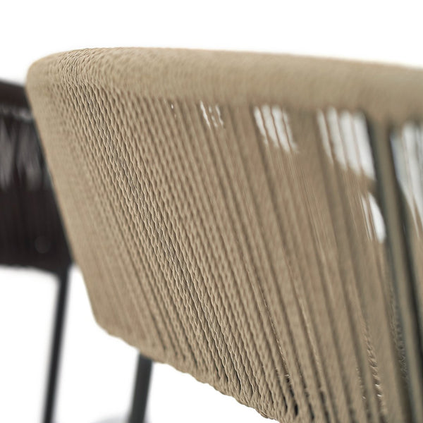Beige rope pattern woven chair with sleek black metal frame, showcasing modern design and texture.