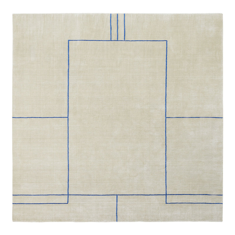 Beige linen rug with geometric blue pattern, featuring outlined rectangles and straight lines.