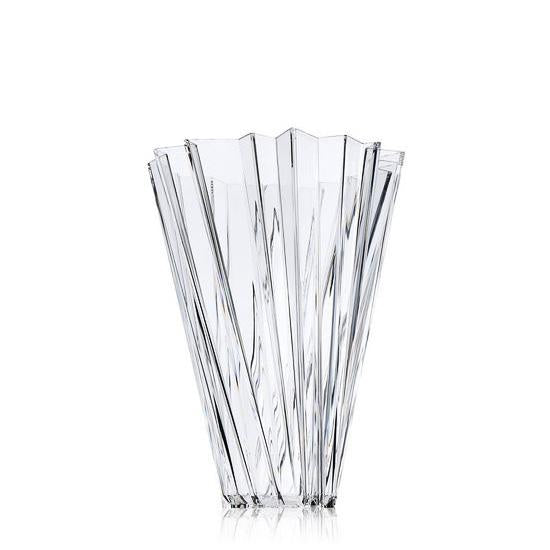 Clear glass vase with a ribbed, fluted design, showcasing modern elegance and prismatic reflections.