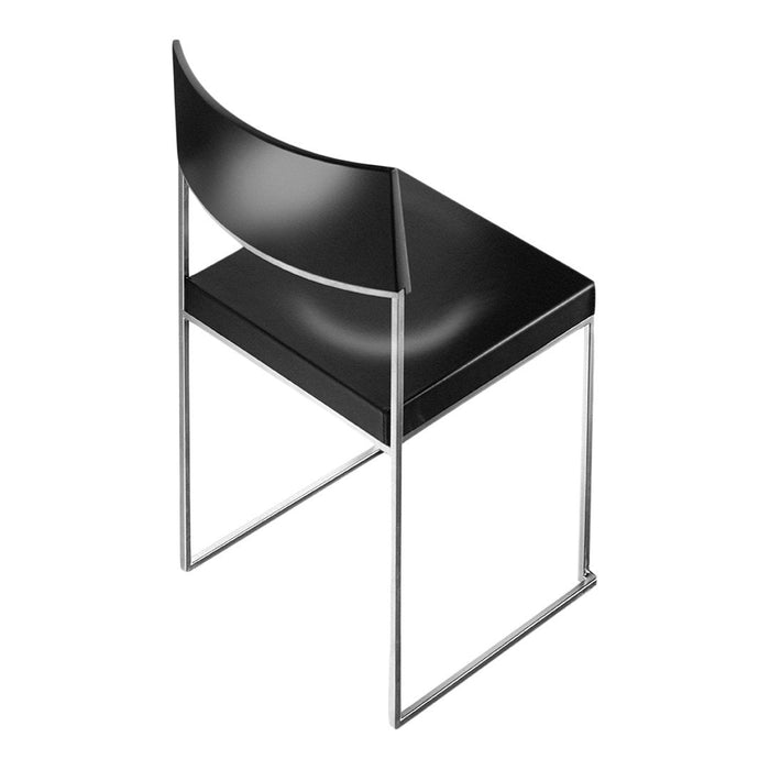 Modern black chair with a sleek design and minimalist chrome frame, featuring smooth, curved lines.