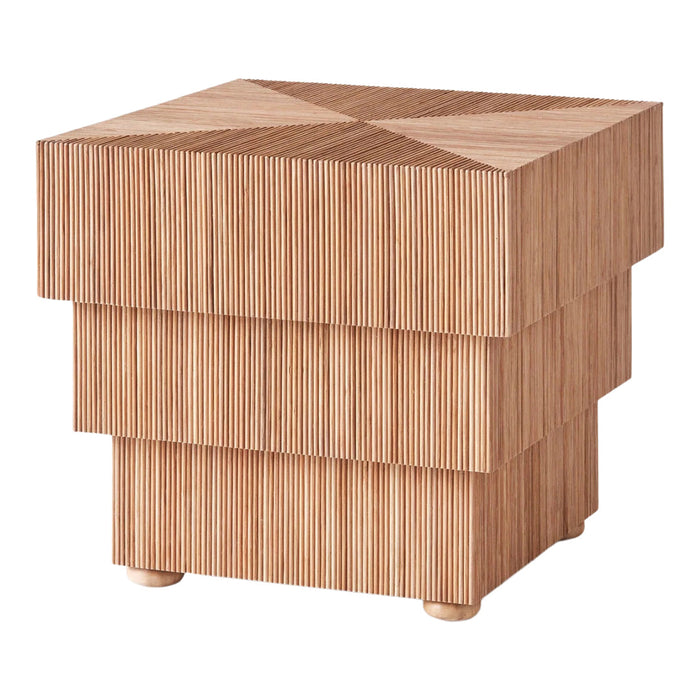 Wooden side table with a layered design featuring light brown hues and vertical ridges for a modern aesthetic.