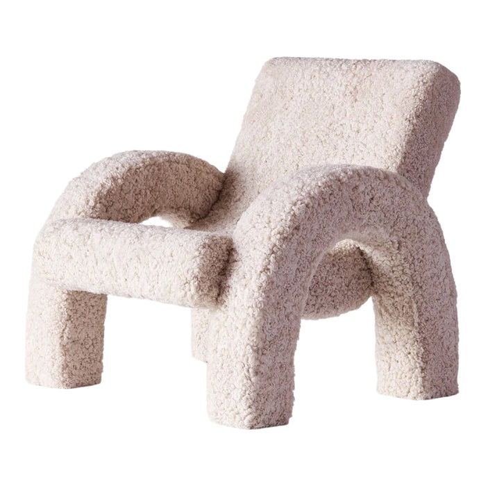 Textured cream-colored chair with a plush, boucle fabric and rounded, minimalist design. Ideal for modern decor.