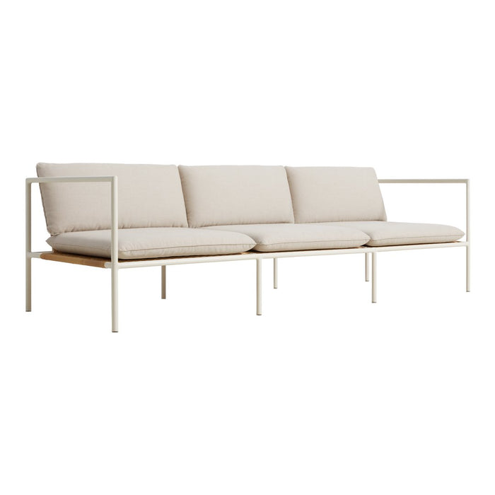 Modern beige sofa with three plush cushions and minimalist white frame, showcasing sleek lines and a neutral color palette.