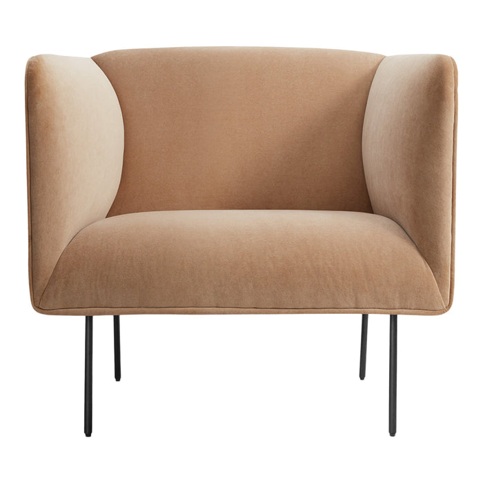 Soft beige velvet armchair with minimalist black legs, featuring a smooth, curved design for modern decor.