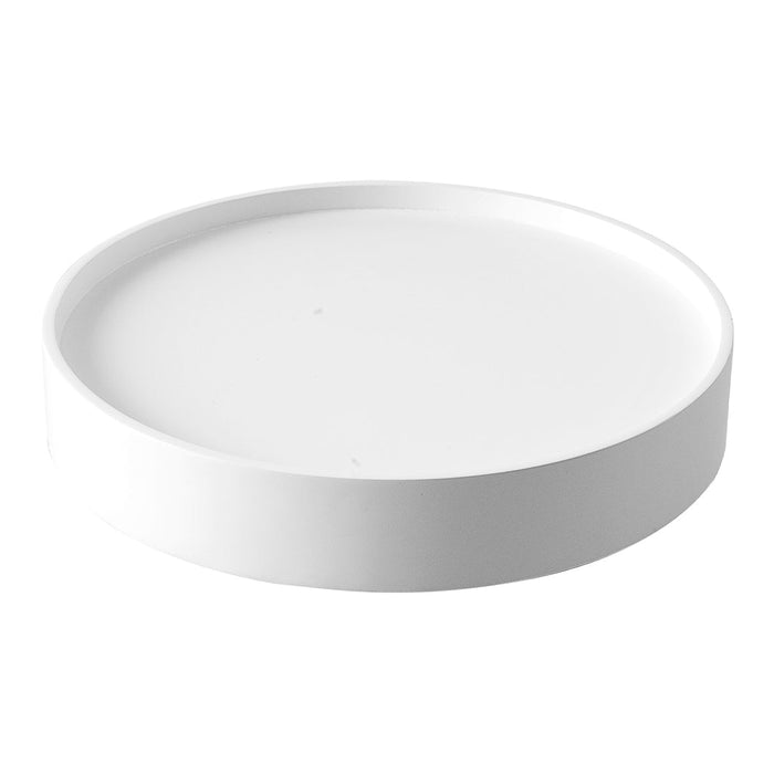 White round tray with a smooth, matte finish, perfect for minimalistic decor and serving.