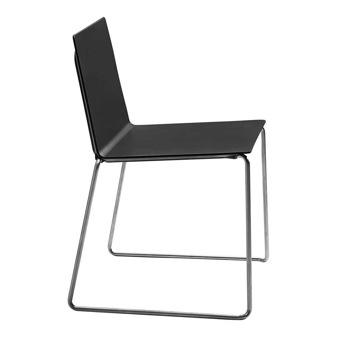 Modern black chair with sleek lines and a minimalist design on a metal frame. Perfect for contemporary spaces.