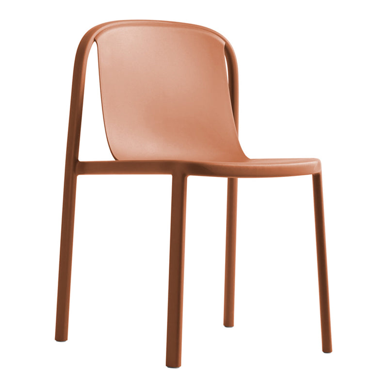 Solid terracotta chair with a smooth finish and minimalist design, perfect for modern interiors.