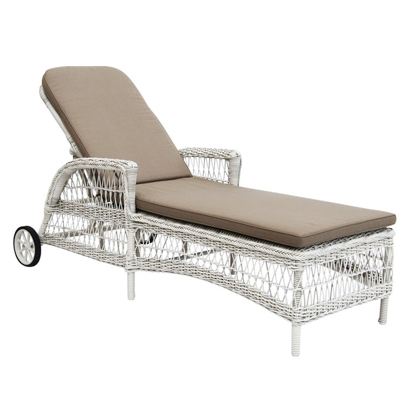 White wicker lounge chair with a light brown cushion, featuring a sleek, modern design and a curved silhouette.