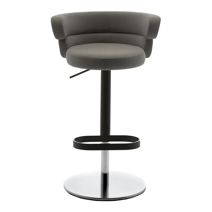 Gray upholstered bar stool with curved back and black metal base, featuring a glossy chrome footrest for added style.