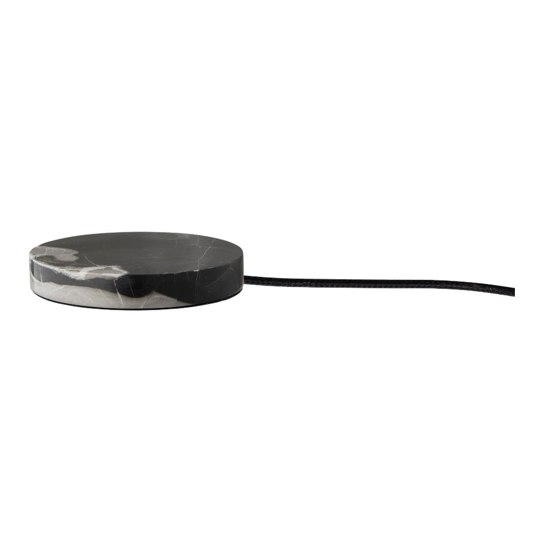 Round, monochrome coaster with a sleek black and gray marble pattern, featuring a smooth surface and tapered edge.