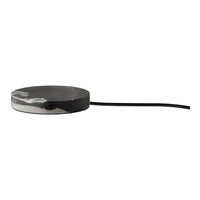 Round, monochrome coaster with a sleek black and gray marble pattern, featuring a smooth surface and tapered edge.