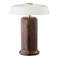 Elegant red-brown marble lamp base with a smooth white glass shade and brass accents, featuring sleek modern design.