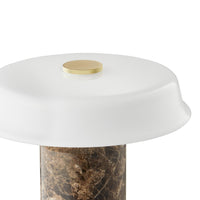 White dome-shaped top with a gold accent, resting on a textured brown marble pedestal. Modern and elegant design.