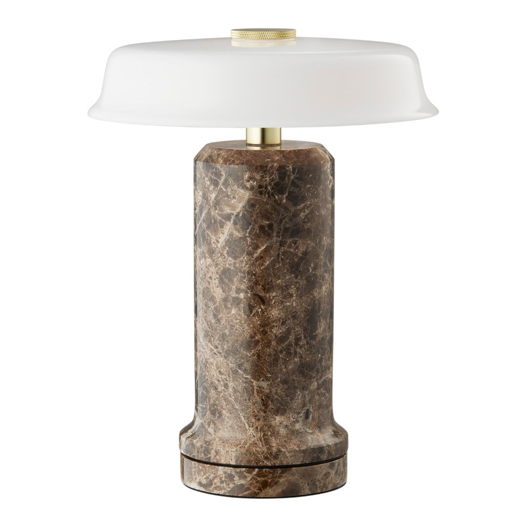 Round lamp featuring a textured brown marble base and a smooth white glass shade, adding elegance to any space.