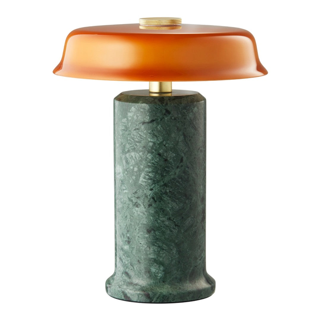 Green marble base with a smooth amber glass shade, creating a modern, elegant lamp design.
