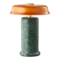Green marble base with a smooth amber glass shade, creating a modern, elegant lamp design.
