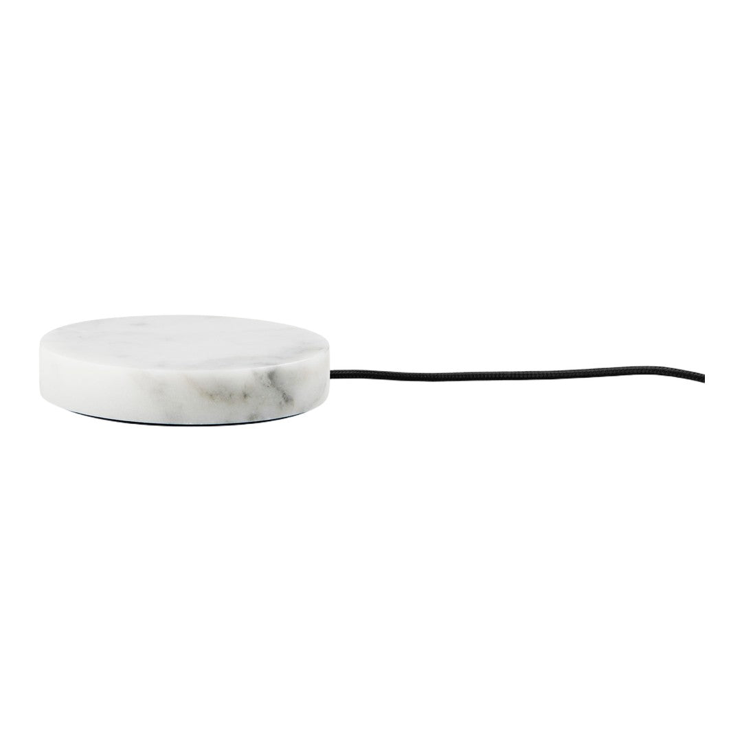Round white marble charging pad with subtle gray veining and a sleek black cord for modern decor.