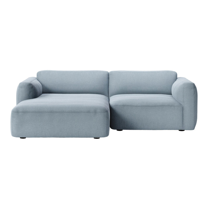 Light blue sectional sofa with a smooth, solid fabric pattern, perfect for modern living spaces.