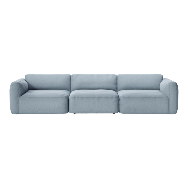 Light blue sectional sofa with a smooth, minimalist design and plush cushions, perfect for modern living spaces.