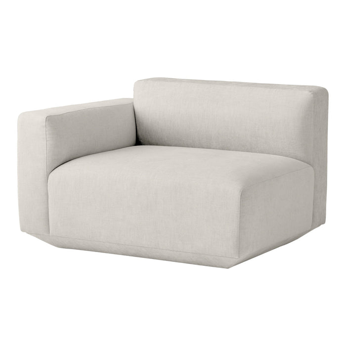 "Soft beige modular couch with a minimalist design and smooth, solid fabric texture."