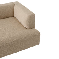 Soft beige sofa corner with textured, cozy fabric, perfect for modern and minimalist interiors.