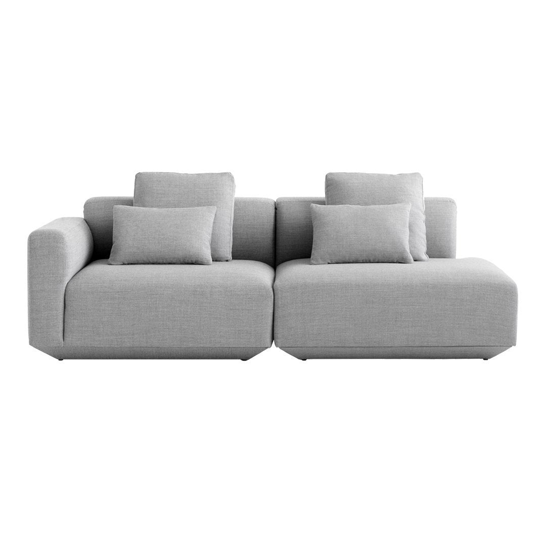 Light gray sectional sofa with plush cushions and a modern, minimalist design, ideal for contemporary living spaces.