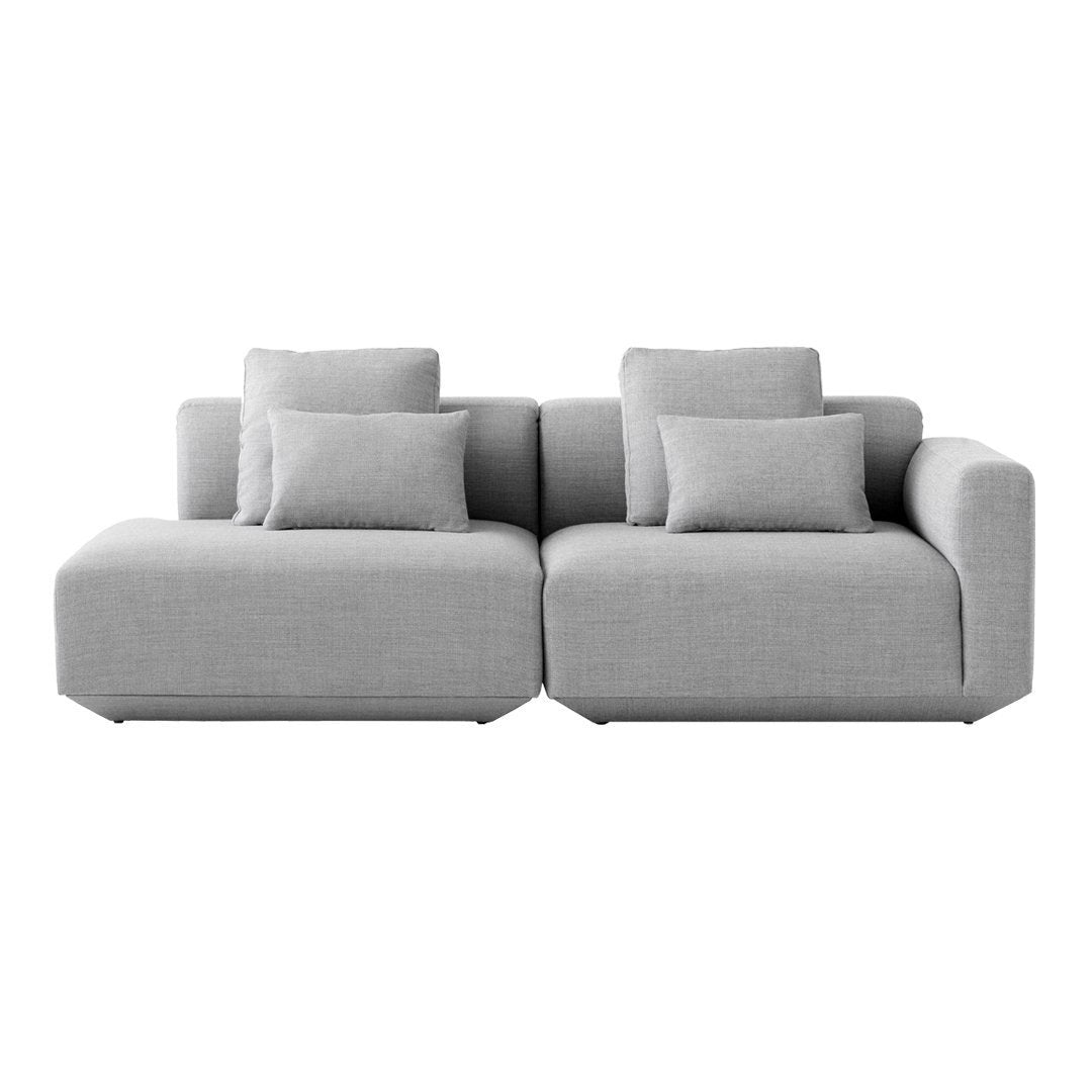 Gray sectional sofa with a modern design and textured fabric featuring plush cushions for added comfort.