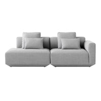 Gray sectional sofa with a modern design and textured fabric featuring plush cushions for added comfort.
