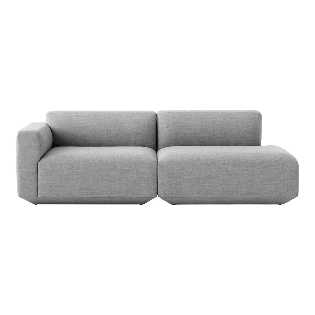 Gray sectional sofa with a minimalist design and soft texture. Perfect for modern living spaces.