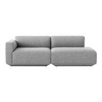 Gray sectional sofa with a minimalist design and soft texture. Perfect for modern living spaces.
