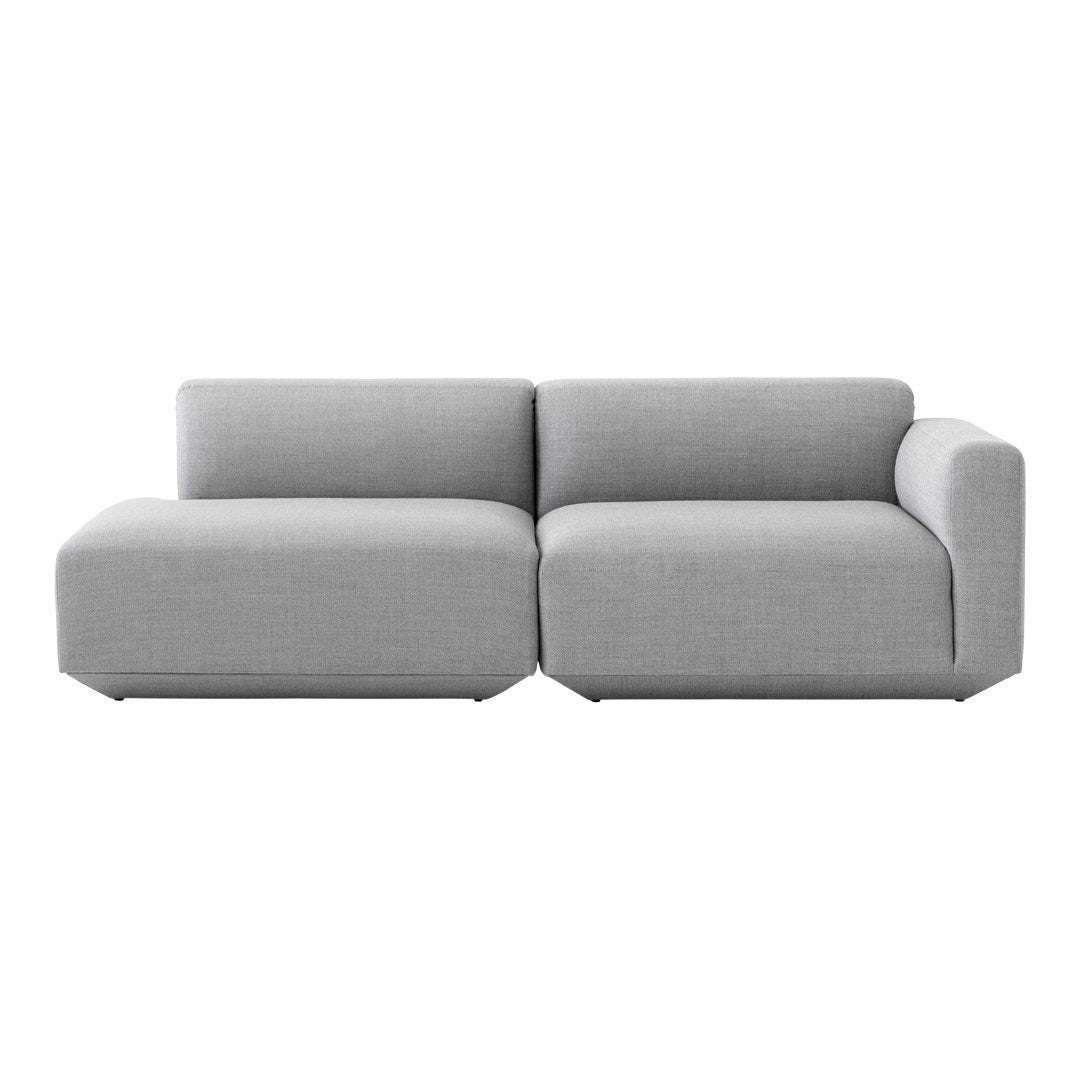 Gray fabric sectional sofa with a modern, minimalist design and clean lines. Ideal for contemporary living spaces.
