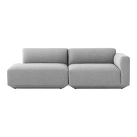 Modern sectional sofa in a soft light gray fabric with a sleek, minimalist design and no visible patterns.