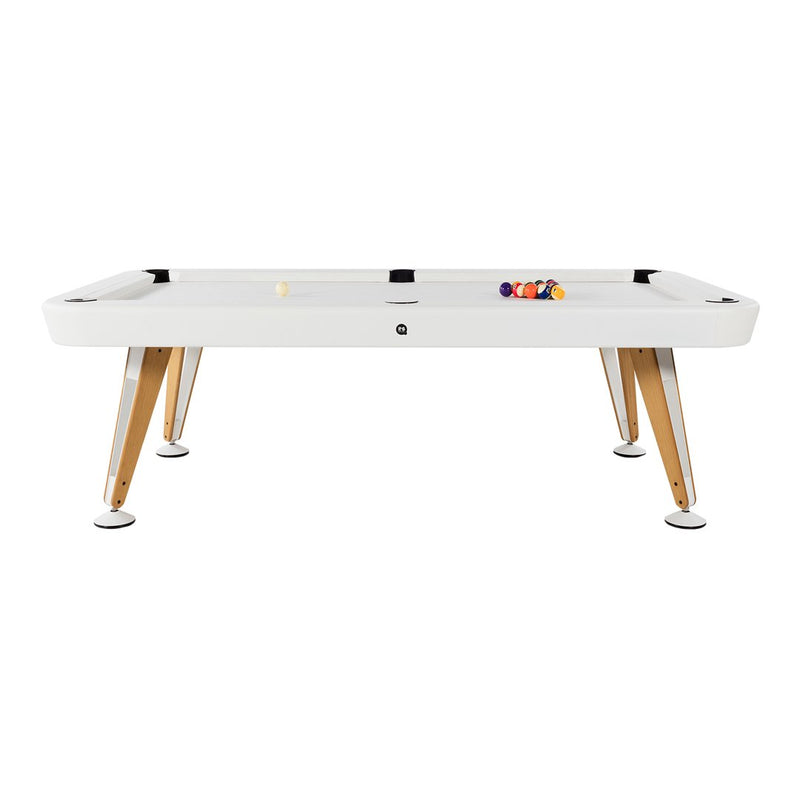 Modern white pool table with natural wood legs and black accents, featuring colorful balls arranged on the surface.