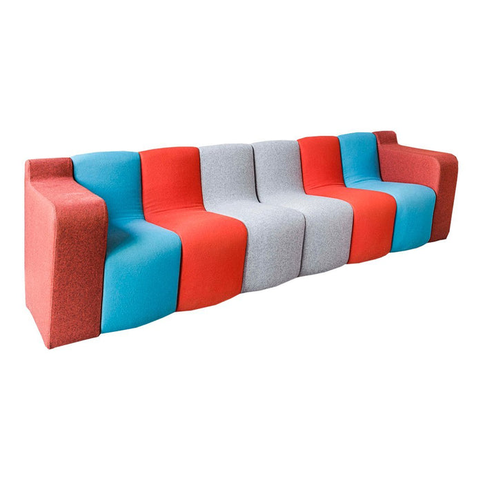 Multicolored sofa featuring blue, red, and gray sections with a unique pattern for modern decor.