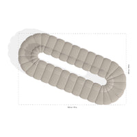 Beige oval rug featuring a plush, tufted design with a smooth, neutral tone and rounded edges. Perfect for any decor.