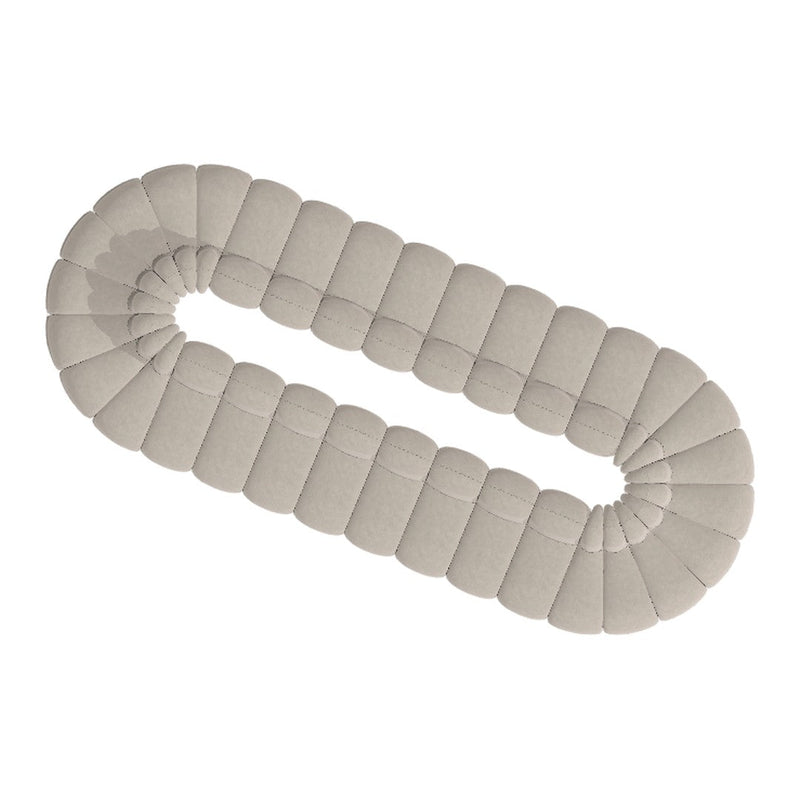 Light beige soft cushion in a rounded, segmented design with subtle stitching detail. Perfect for home decor.