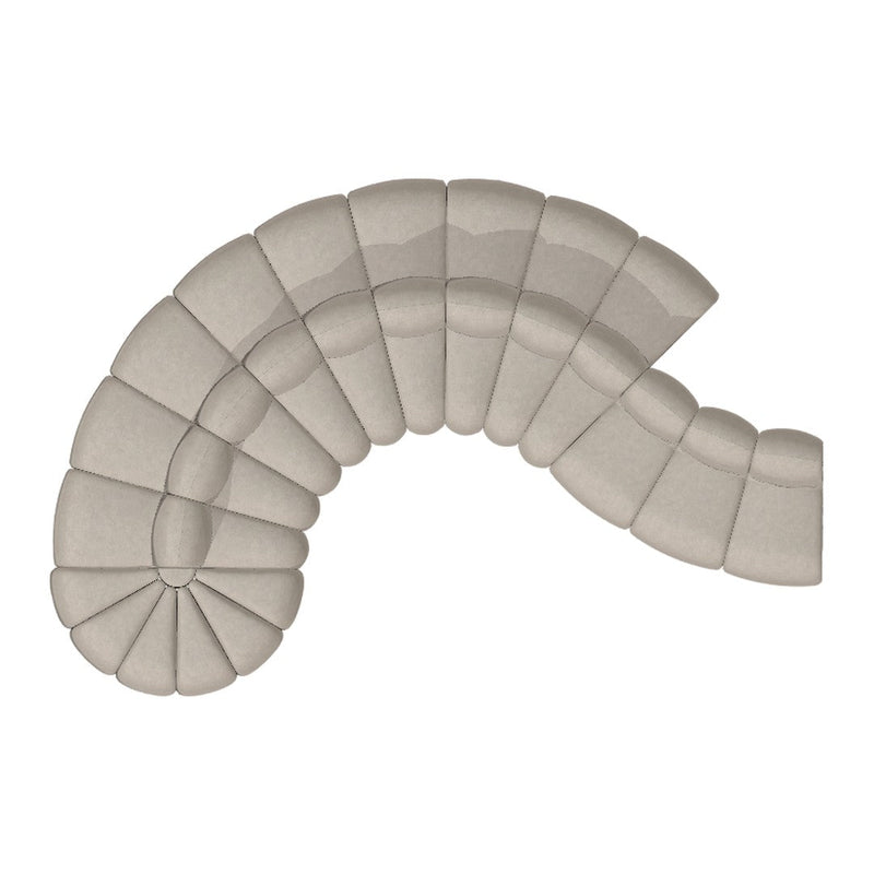 Curved beige sofa with a quilted pattern, featuring soft, smooth textures for modern decor.