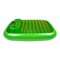 Bright green tray with vibrant orange pegs, featuring a smooth glossy surface and a patterned design.