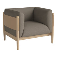 Modern armchair in soft gray upholstery with a light wood frame and sleek, minimalistic design.
