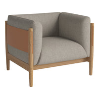 Grey upholstered armchair with tan accent and natural wood frame. Modern, minimalist design with a soft texture.