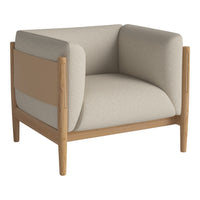 Beige and cream color-block upholstered armchair with natural wood frame. Modern, minimalist design.