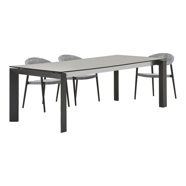 Gray rectangular dining table with black legs and four textured gray chairs. Simple, modern design with minimal patterns.