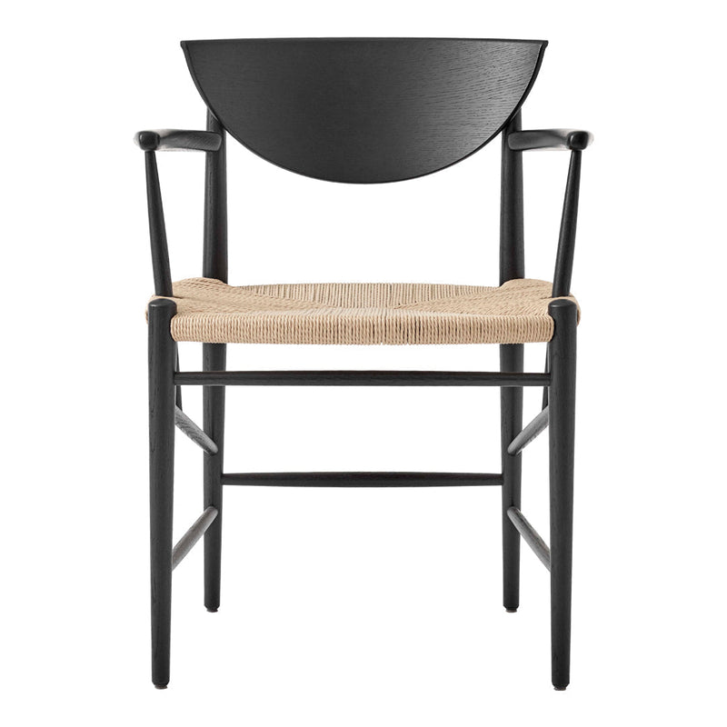 Black wooden chair with a half-moon backrest and natural woven seat, featuring a minimalist design.
