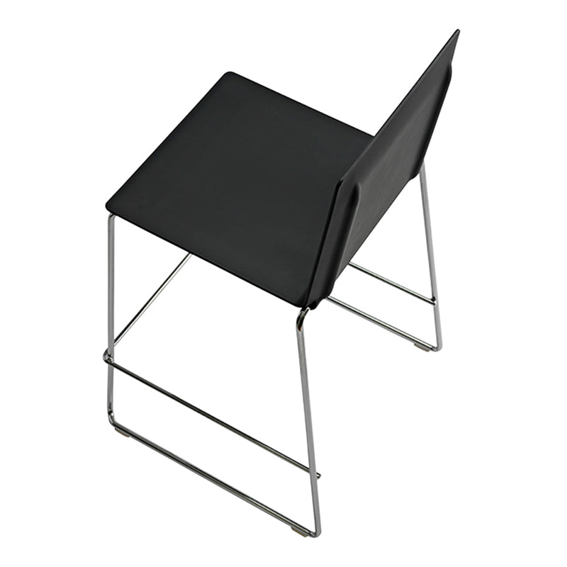 Black minimalist chair with a sleek design and chrome legs, featuring a smooth, matte finish. Ideal for modern decor.