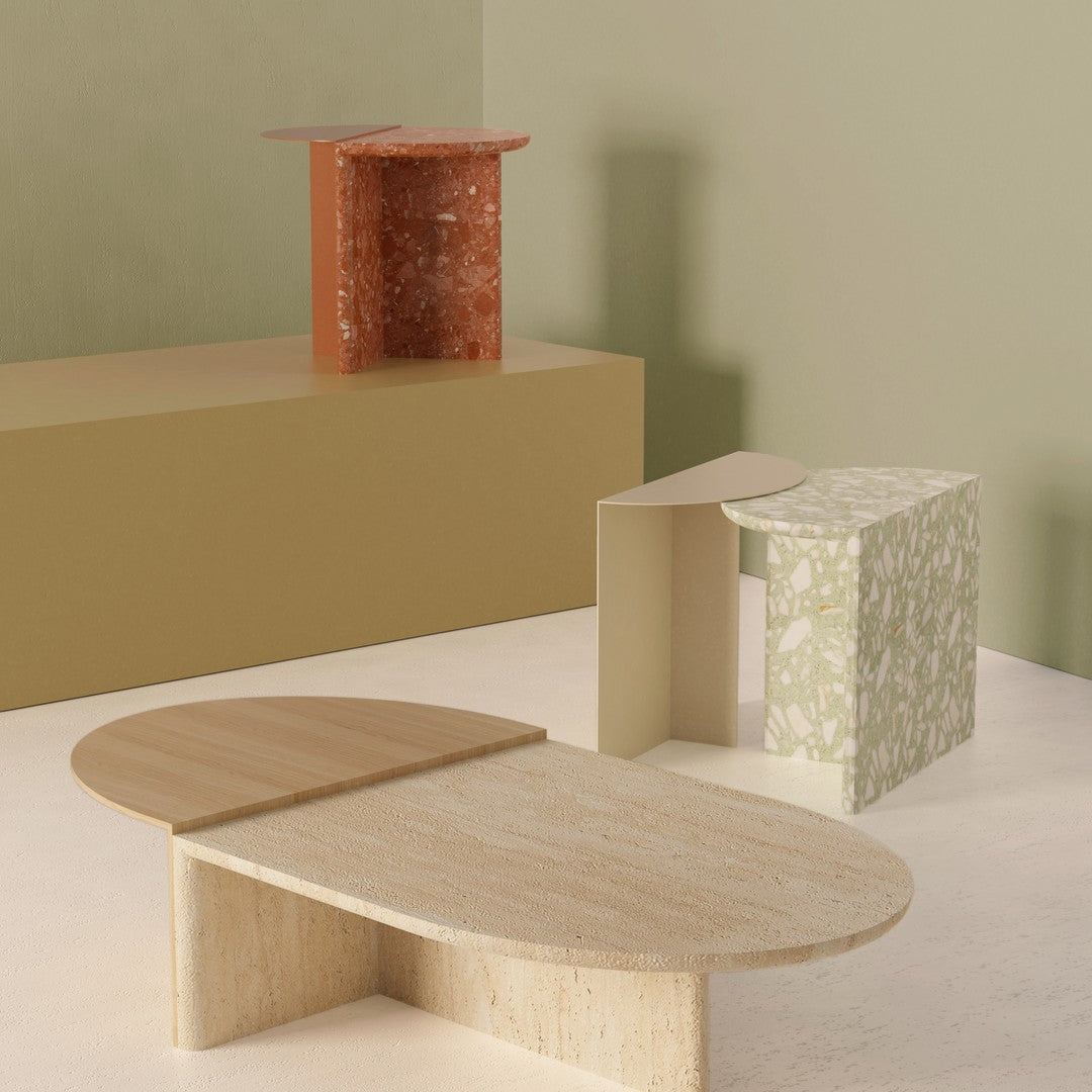 Colorful geometric decorative tables in terracotta, green floral, beige, and natural wood finishes.