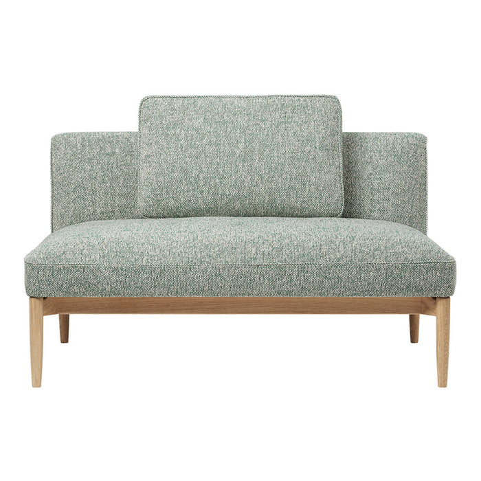 Light green textured upholstery with a subtle pattern, complemented by natural wood legs. Stylish and modern design.