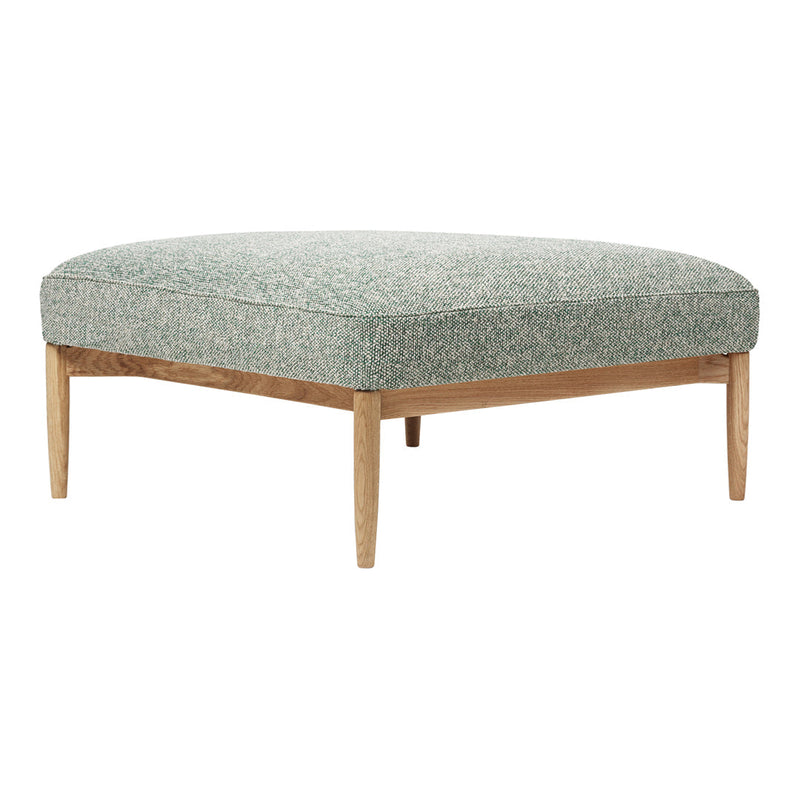Green patterned ottoman with light wood legs, featuring a textured fabric design. Perfect for modern decor.
