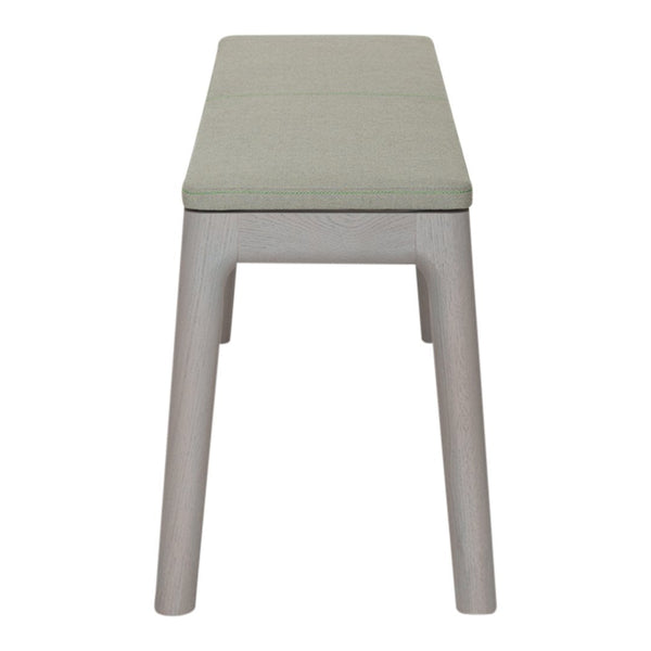 Light gray bench with a soft green cushion, featuring a simple, modern design and clean lines.