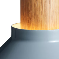 Grey lamp base with a natural wood column and warm glowing light, featuring smooth and sleek design elements.