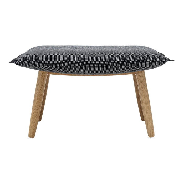 Gray upholstered ottoman with a textured pattern, featuring natural wood legs for a modern look.